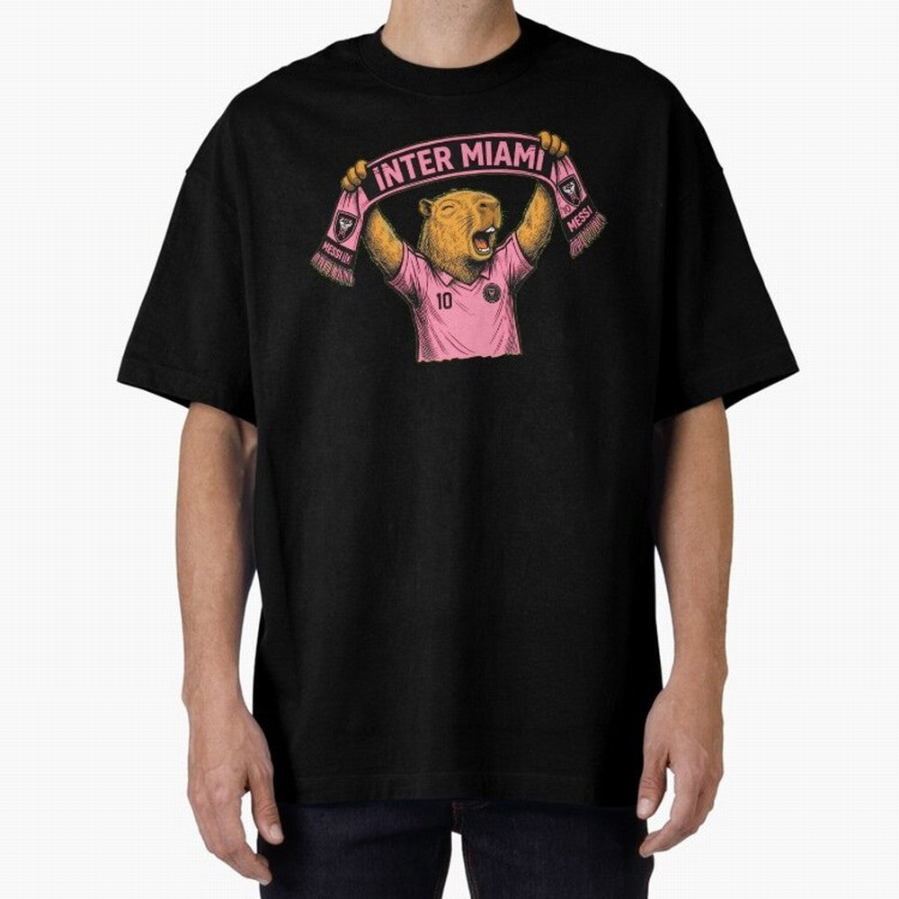 Capybara Inter Miami Fan Celebrating ¨C Funny Soccer Illustration with Scarf Oversized T-Shirt Bring Retro Soccer Energy to FIFA World Cup 2026 Group Stage Spirit, Capturing Spain and Netherlands, CR7 and Messi, Fan Favorite Moments, National Team